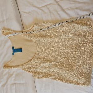 Embellished sewn on pearl tank top.